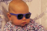 Baby with sunglasses on.